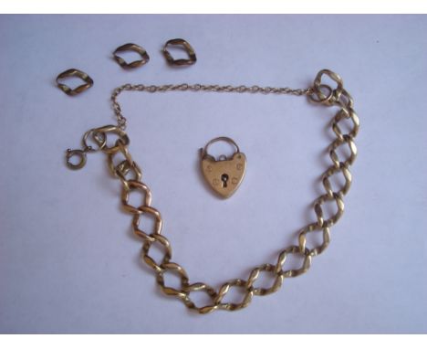 A 9ct flat curb charm bracelet with padlock and safety chain, a/f, approx 18.5g. 