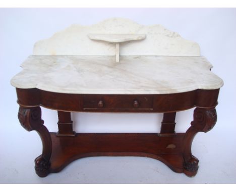 A Victorian mahogany marble topped washstand, the shaped top with moulded edge and raised back with central shelf above a fri