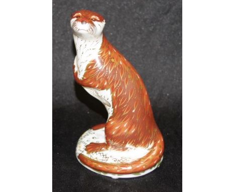 Royal Crown Derby "Playful Otter" paperweight with gold button seal to base, height 16cm approx