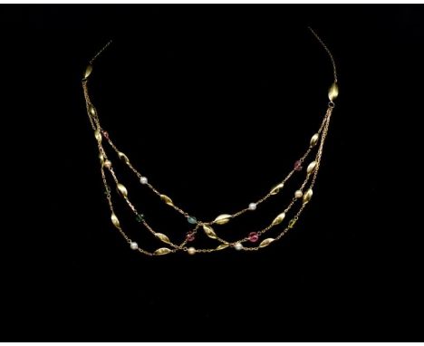 18ct yellow gold and multi gemstone necklace with three strand chain links, set with pearls and tourmalines. Marked 750. Appr