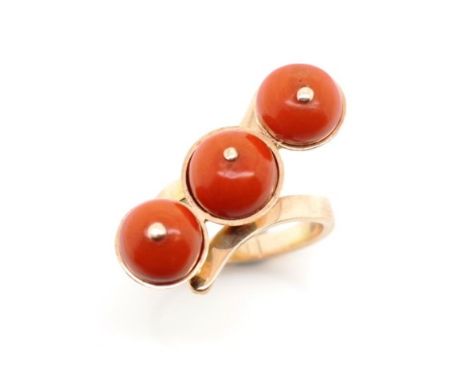 14ct rose gold and three stone coral ring with Polish 14ct marks. Approx weight 9.2 grams, ring size M