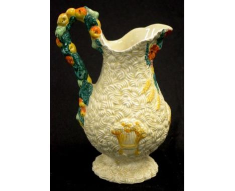 Clarice Cliff 'Celtic Harvest' ewer embossed blossom and fruit decoration, marked to base, (height 21.5cm approx).