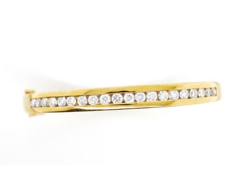 2.00ct diamond set 18ct yellow gold bangle with channel set diamonds, hinge, safety catch and box clasp. Marked 750 Gregory. 