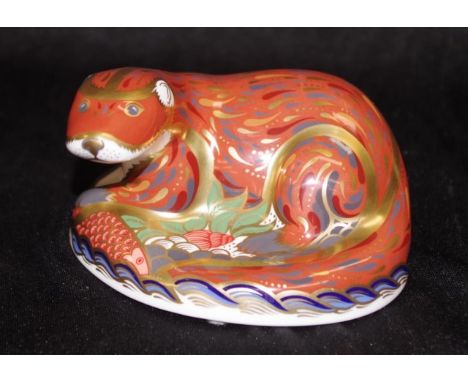 Royal Crown Derby "Otter" paperweight with gold button seal to base, width 11cm approx