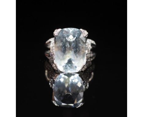 Aquamarine and diamond ring by Musson in an 18ct white gold setting, mount and shank. Approx 1x Aquamarine cushion cut 7.59ct