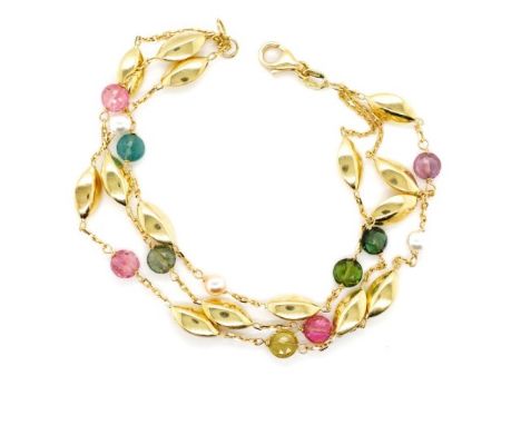 18ct yellow gold and multi gemstone bracelet with three strand chain links, set with pearls and tourmalines. Marked 750. Appr