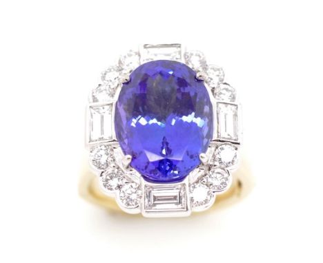 Tanzanite and diamond set 18ct two tone gold ring by Percy Marks. Marked PM 750. Approx Tanzanite size 9mm x 12mm x 5.5mm (de