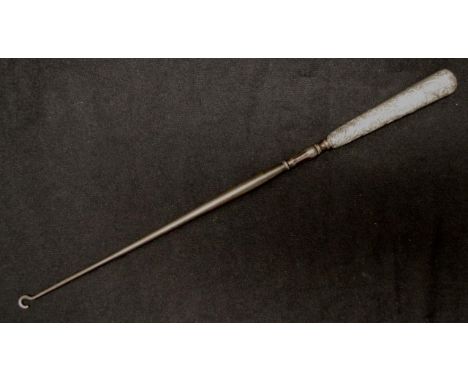 Antique Sterling silver handle button hook hallmarks rubbed, embossed decoration to handle, (length 36cm approx).