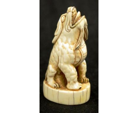 Chinese carved ivory Kylin seal seal character marks to base, (height 8cm approx). NOTE: Export of this item is not permitted