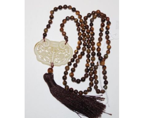 Tigers eye beaded necklace with a jade pendant length 58cm approx