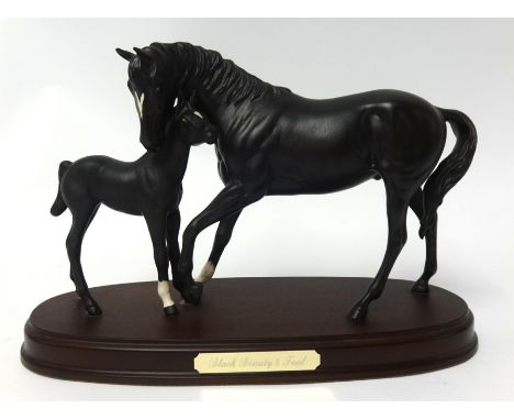 A Beswick model of 'Black Beauty & Foal' on wood base, 20cm