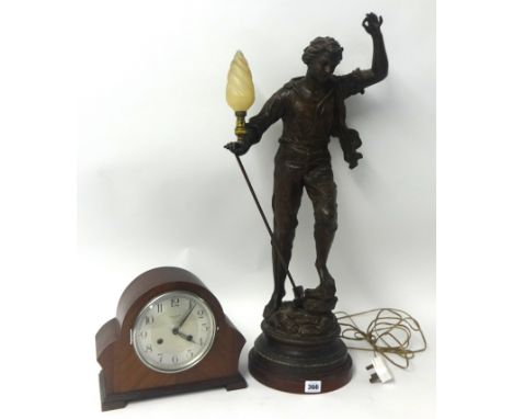 A Large speltar figurative table lamp after Rancoulet also a wood case eight day chiming mantle clock and a copper bed warmer