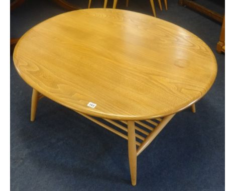 Ercol, a light elm coffee table with magazine rack.