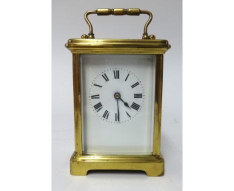 A French brass cased carriage clock, platform escapement, key wind, the white enamel dial set with roman numerals, height 14c