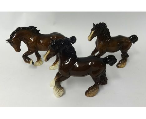 Pair of Beswick cart horses and a similar Royal Doulton horse, 22cm