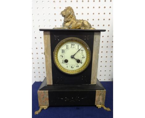 A Victorian slate/marble mantle clock, surmounted with a lion, height 34cm.