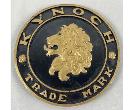 A Kynoch ammunition manufacturer trade plate, painted black and gold. Approx. 13.5cm diameter. 