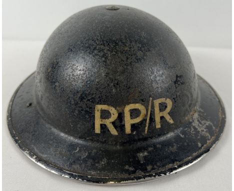A WWII British MkII Home Front steel helmet labelled RP/R in white front &amp; back. For Repair Party/Roads. Liner stamped BM