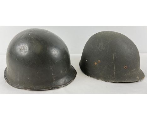 An Argentine M1 steel helmet, front rim stamped 1858/B37. This is a repainted US rear seam M1 steel helmet with Argentine loc