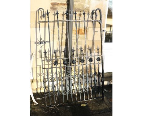 A 20th Century Cast Iron Garden Gate, repainted black, the uprights with C scrolls and flowerheads with fleur-de-lys-style ra