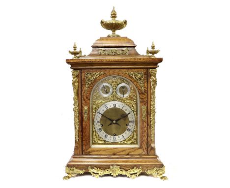 An Oak Chiming Table Clock, circa 1890, case surmounted by urn finials, gilt metal mounts, front scroll and mask decorated ca