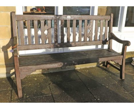 A 20th Century Teak or Hardwood Garden Bench, labelled Stanland &amp; Co, Boat Builders, Thorne, with slatted back support an