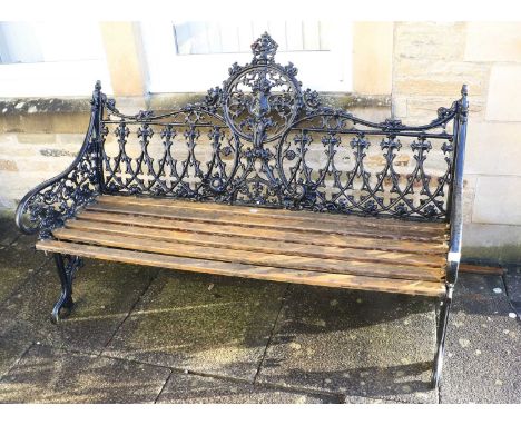 A Victorian-Style Cast Metal and Black-Painted Garden Bench, late 20th century, with gothic tracery-style back support with s