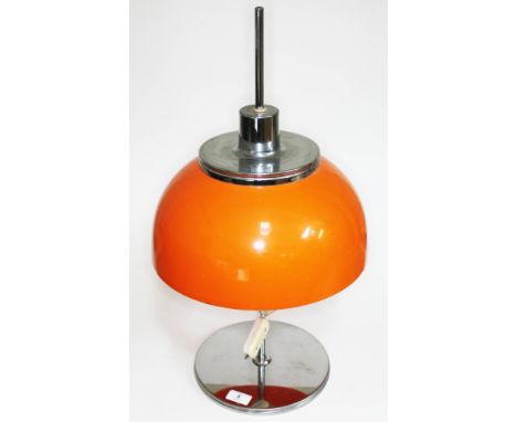 A Harvey Guzzini Faro adjustable table lamp with space age orange plastic shade, Harvey Guzzini sticker to shade exterior and