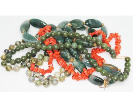 A mixed lot of bead necklaces comprising moss agate, coral, nephrite jade and another green bead necklace (probably serpentin