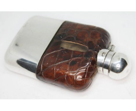 A miniature silver plated hip flask, length 11cm.  