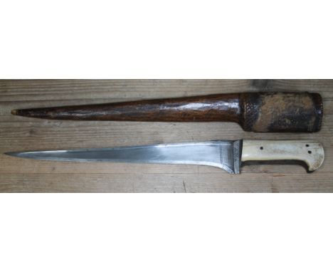 A North African Flyssa with bone handle and wooden scabbard, total length 53cm.  