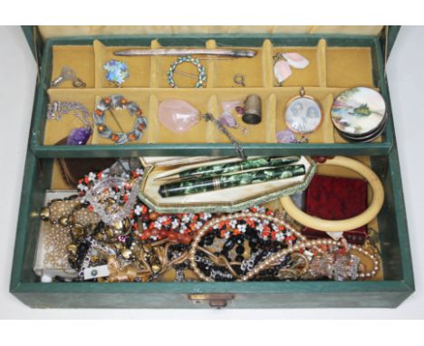 A mixed lot comprising mainly costume jewellery including beads, brooches etc. together with a hallmarked silver enamel box, 