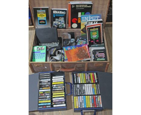 A trunk containing vintage computer consoles and games.  