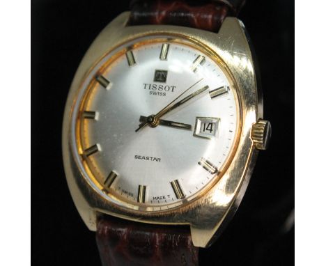 A 1973 Tissot Seastar gold plated manual wind wristwatch having signed champagne dial, hands and hour markers in gold and bla