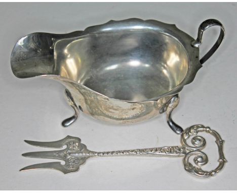 Two items of hallmarked silver: a sauce boat length 14.5cm and a toasting fork length 13.5cm, wt. 4oz.  
