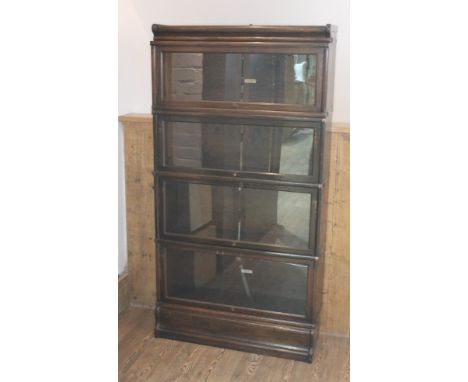 A Globe Wernicke four part sectional bookcase, width 87cm, depth 30cm &amp; height 165cm, interior labels.  