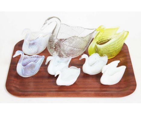 A group of eight late 19th century pressed glass swan salts comprising four Burtles, Tate & Co and four others similar, lengt