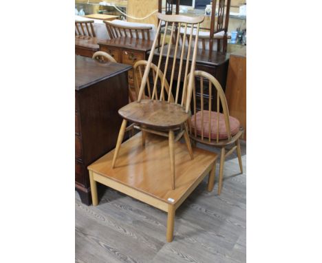 A modern Ercol light elm coffee table and a single Ercol elm seated spindle back chair.  Some slight wear to the finish.