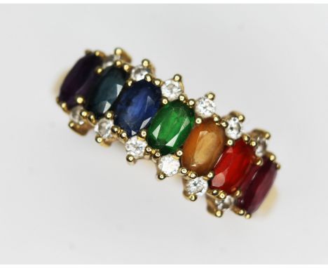 A multi-gem set ring set with sapphires, ruby, diamonds, amethyst, tourmaline, hallmarked 18ct gold band, gross wt. 3.95g, si