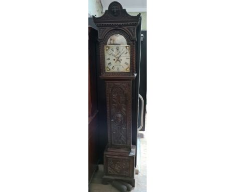 A carved oak longcase clock, dial signed Hancock - Castle Cary, 8 day. with clock key , case key, pendulim and weights.