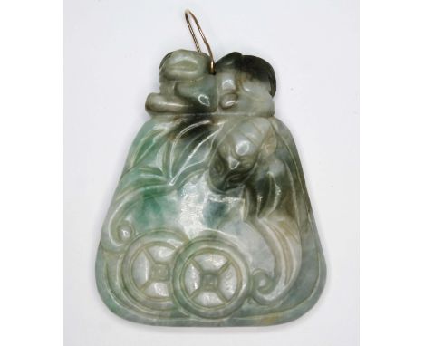 A Chinese apple and celadon jade pendant, carved with a flying bat, length 57mm.  Condition - good, general wear including mi