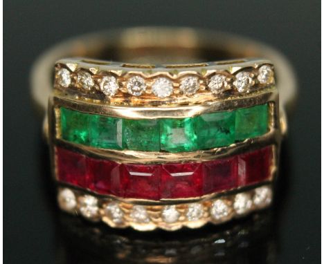 A diamond, ruby and emerald four row ring, head measuring approx. 17mm x 13mm, band marked '18k', gross weight 5.42g, size Q.