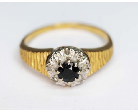 A diamond and sapphire ring, indistinctly marked, gross wt. 4.36g, size Q/R.  
