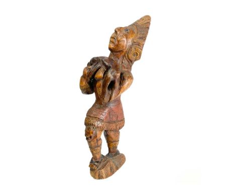 A wooden carved figure of a Mayan Indian. Height 61cm.