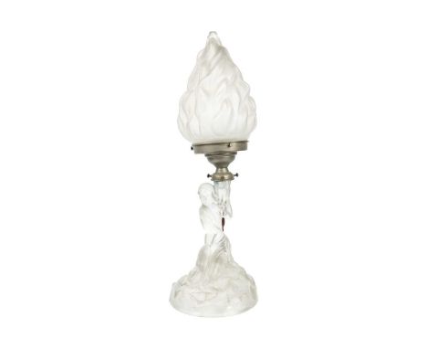 An Art Deco moulded glass table lamp. The lamp supported by a maiden, on a rocky circular base, height 26cm, with an opaque g