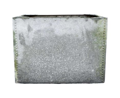 A galvanised and rivetted tank/planter. Height 69cm, width 95cm, depth 67cm.Unfortunately the tank is NOT water tight, some r