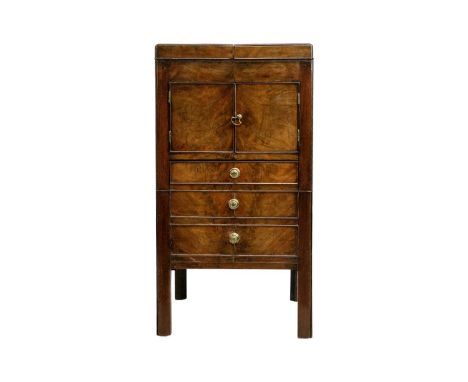 A George III mahogany gentleman's washstand/commode. With hinged top, above a cupboard and three dummy drawers on square cham