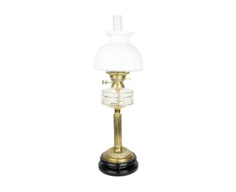 A late Victorian cut glass and brass oil lamp. With ceramic base and opaque shade, height 68cm.