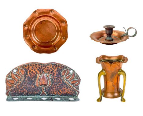 A copper chamberstick by Henry Loveridge. Diameter 18cm, together with an Art Nouveau copper and brass vase, copper pipe rack