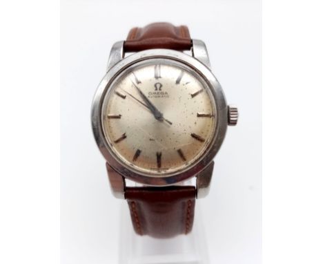 A Vintage 1950s Omega Seamaster. Brown leather strap with stainless steel case - 35mm. Automatic movement. Slight wear on dia